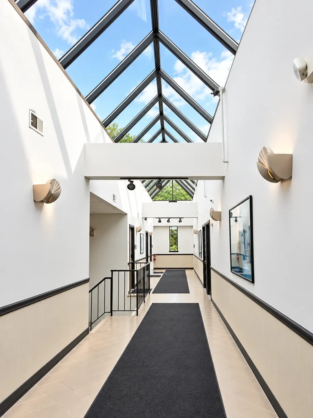 Skylit hallway leading to the office