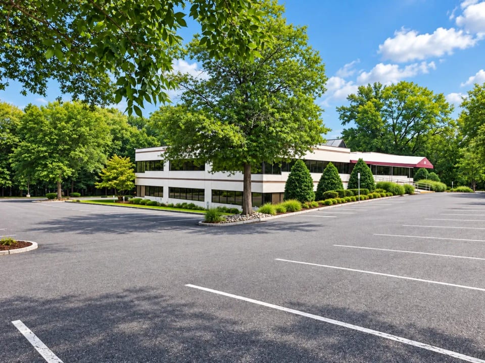 The office building and its large parking lot